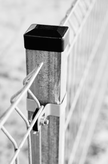 vertical-greyscale-closeup-shot-metal-grid-fence-pole_181624-18000_10_11zon.jpg