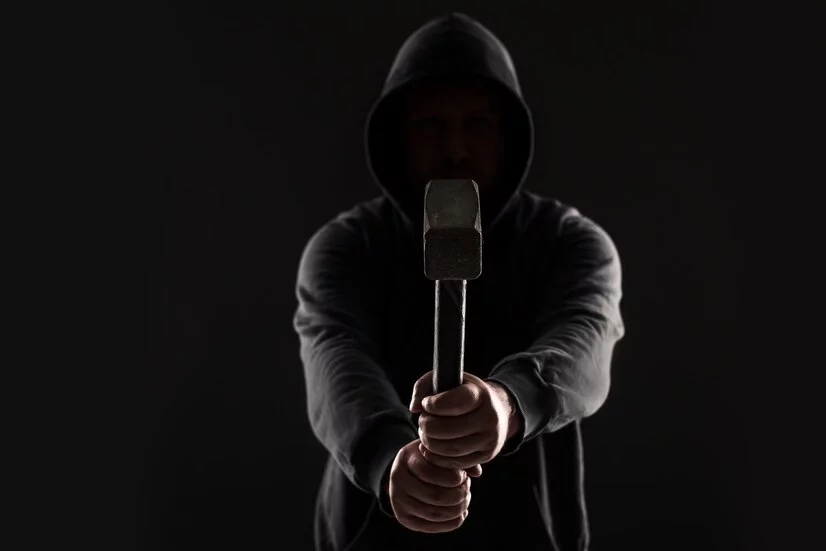 criminal-in-dark-clothes-and-balaclava-with-hammer_157927-14930.jpg